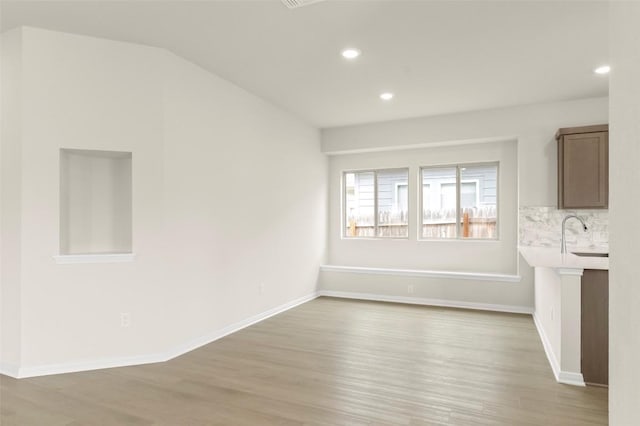 359 Witchhazel Way, San Marcos, TX 78666 - unfurnished living room with light wood finished floors and recessed lighting