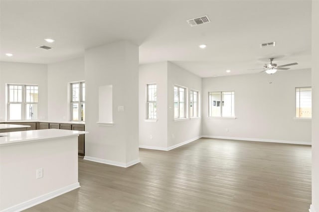359 Witchhazel Way, San Marcos, TX 78666 - unfurnished living room with recessed lighting, a ceiling fan, and dark wood-style floors