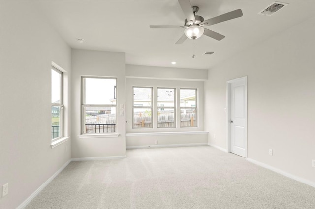 359 Witchhazel Way, San Marcos, TX 78666 - empty room with a ceiling fan, carpet floors, baseboards, and plenty of natural light