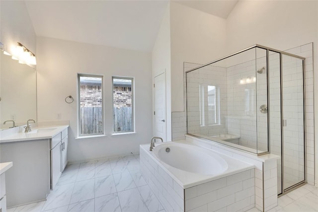 263 Diamondleaf Dr, Buda, TX 78610 - bathroom with marble look tile flooring, a shower stall, a garden tub, and vanity