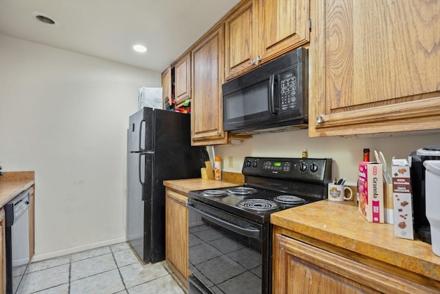 2529 Rio Grande St Unit 7, Austin, TX 78705 - kitchen featuring black appliances, light countertops, light tile patterned floors, brown cabinetry, and recessed lighting
