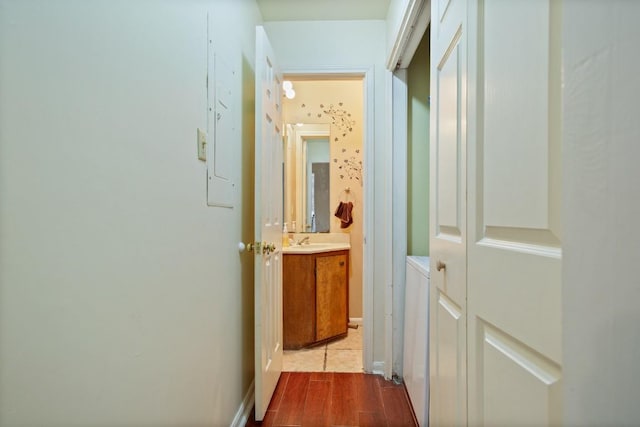 2529 Rio Grande St Unit 7, Austin, TX 78705 - hallway with a sink and light wood-type flooring