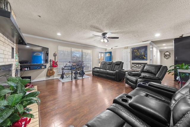 living area featuring crown molding, recessed lighting, a ceiling fan, a textured ceiling, and wood finished floors