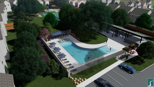 aerial perspective of suburban area featuring a pool area