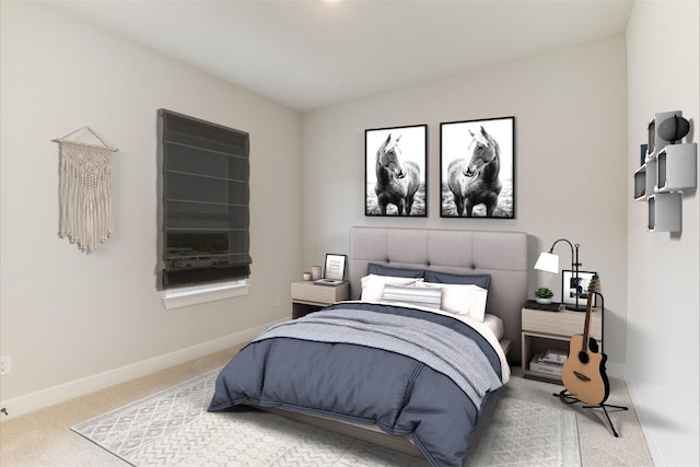 carpeted bedroom with baseboards