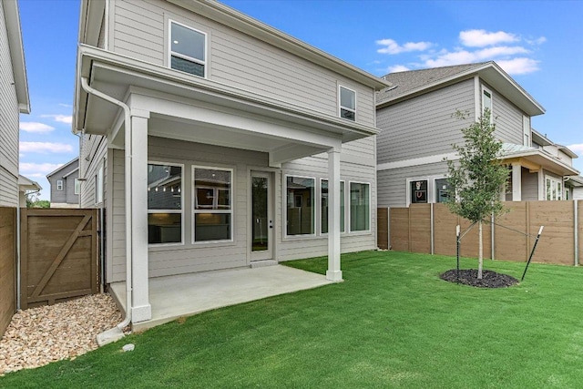 back of house with a patio