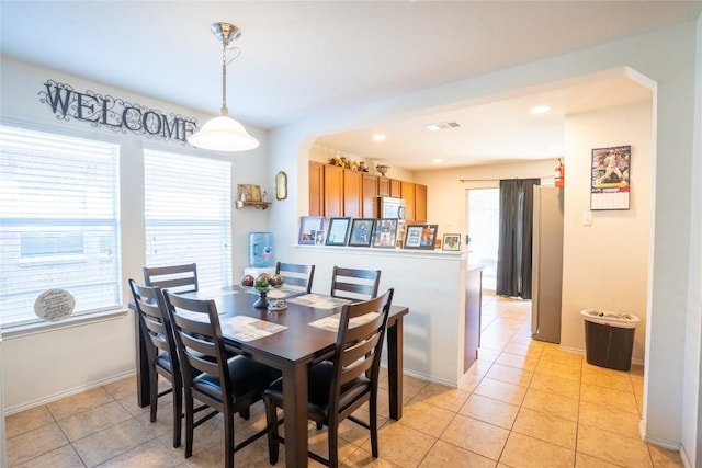 dining area with recessed lighting, baseboards, and light tile patterned floors