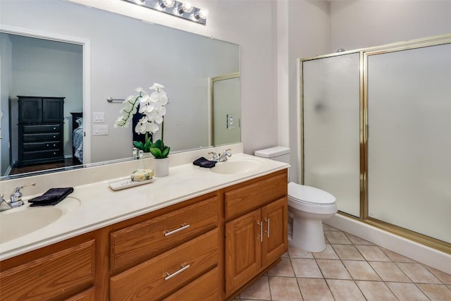 ensuite bathroom with a shower stall, ensuite bath, a sink, and tile patterned floors