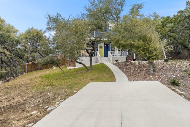 578 Firefly Dr, Canyon Lake, TX 78133 - view of property hidden behind natural elements featuring covered porch