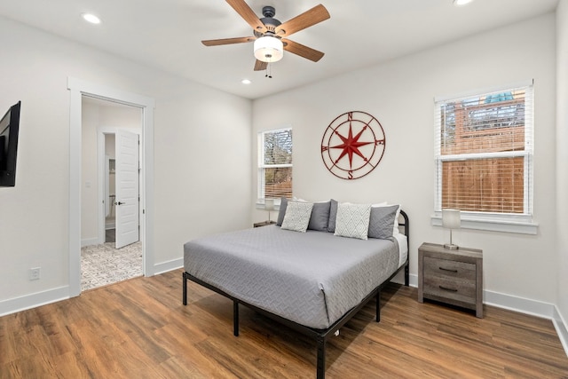 bedroom with baseboards, ceiling fan, wood finished floors, and recessed lighting