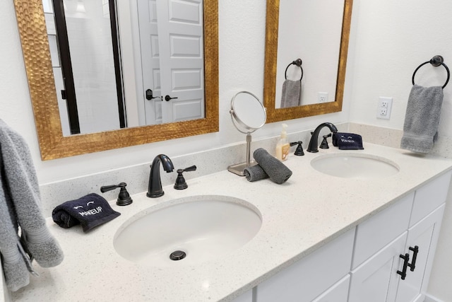 bathroom featuring double vanity and a sink