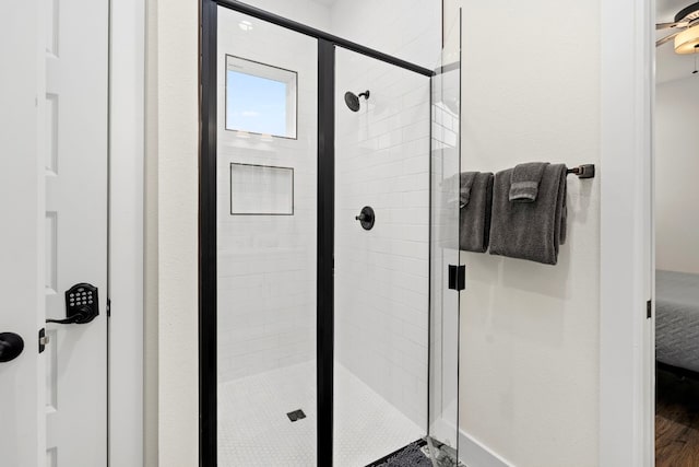 bathroom featuring a shower stall