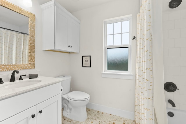 bathroom with shower / bath combination with curtain, toilet, vanity, and baseboards