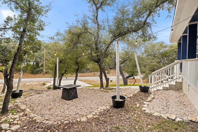 view of yard featuring a fire pit