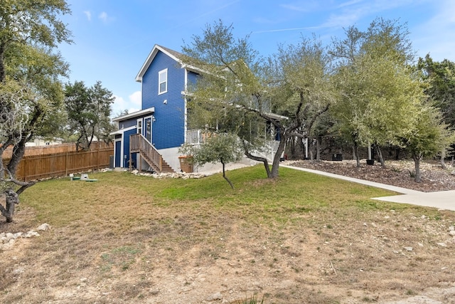 exterior space featuring stairs and fence