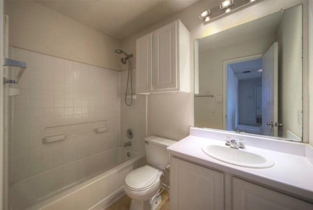 bathroom with toilet, shower / washtub combination, and vanity