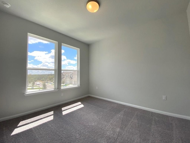 320 Creek Rd Unit 303, Dripping Springs, TX 78620 - unfurnished room featuring dark colored carpet, baseboards, and a smoke detector