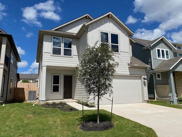 view of front facade featuring concrete driveway, board and batten siding, a front yard, fence, and a garage