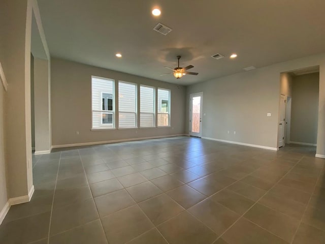 spare room featuring tile patterned flooring, recessed lighting, a ceiling fan, baseboards, and visible vents