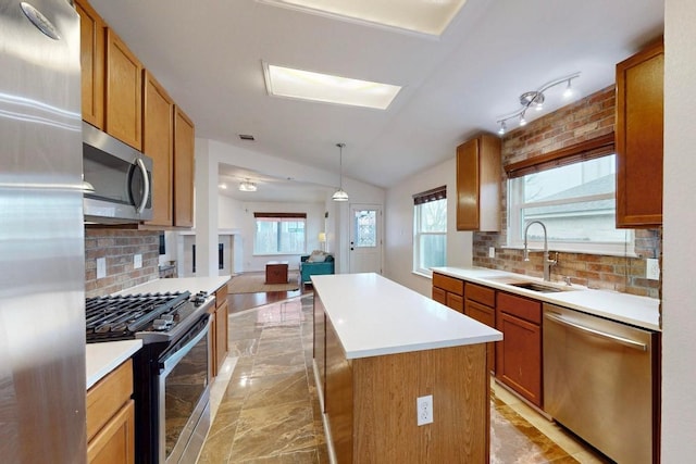 kitchen featuring a sink, light countertops, appliances with stainless steel finishes, marble finish floor, and a center island