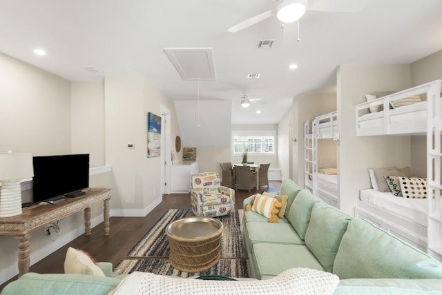 living room featuring attic access, baseboards, visible vents, ceiling fan, and dark wood-type flooring