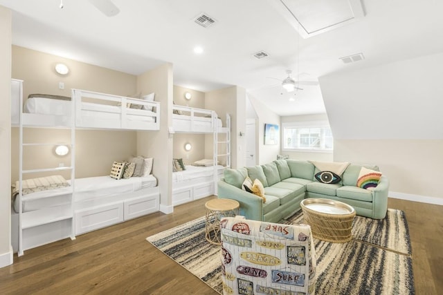 bedroom featuring baseboards, visible vents, and dark wood-type flooring