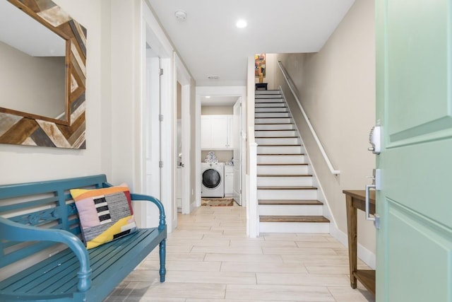 interior space with baseboards, independent washer and dryer, wood tiled floor, stairs, and recessed lighting