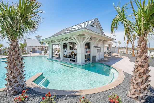 community pool featuring a gazebo, a patio, and fence