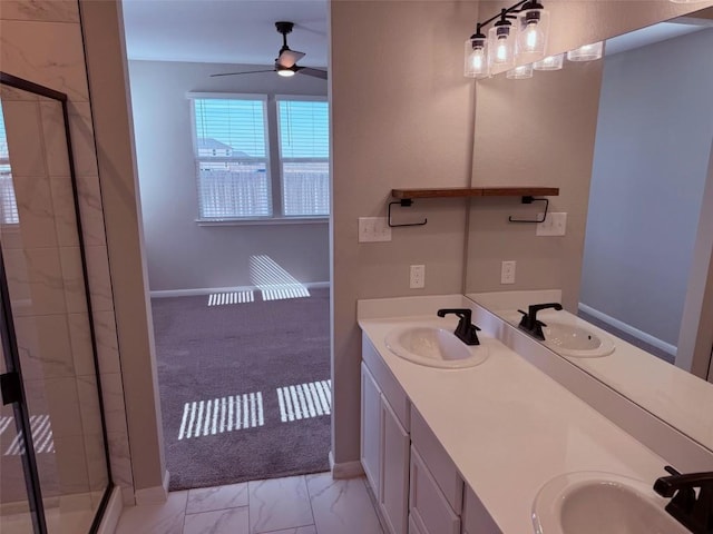 full bathroom with marble finish floor, a sink, and double vanity