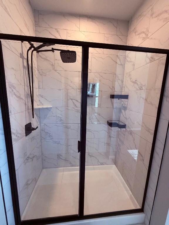 bathroom with a stall shower