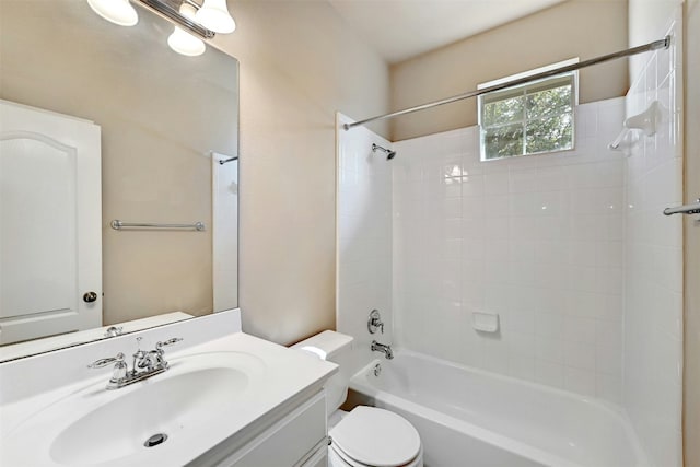 bathroom with toilet, shower / washtub combination, and vanity