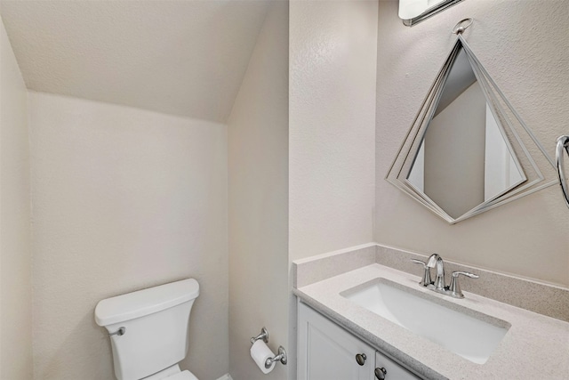 11000 Anderson Mill Rd Unit 52, Austin, TX 78750 - half bathroom featuring toilet, vanity, and lofted ceiling