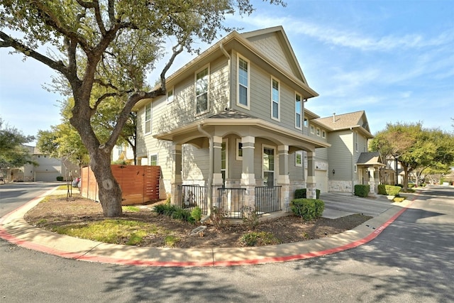 traditional style home featuring a residential view and fence