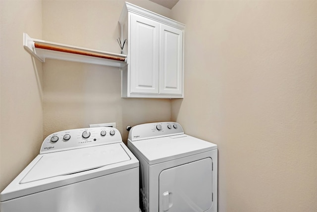 laundry room featuring cabinet space and independent washer and dryer