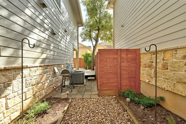 11000 Anderson Mill Rd Unit 52, Austin, TX 78750 - view of side of home featuring a patio and central AC