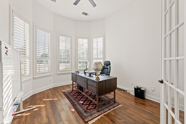 home office with baseboards, hardwood / wood-style floors, visible vents, and a ceiling fan