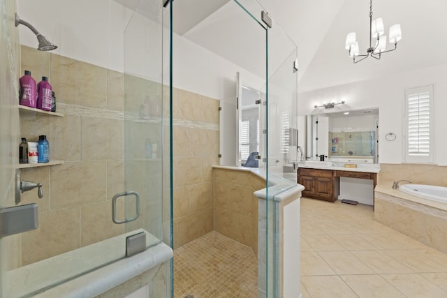 bathroom with a stall shower, lofted ceiling, tile patterned floors, a garden tub, and vanity