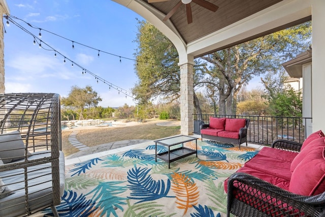 view of patio with ceiling fan and an outdoor living space