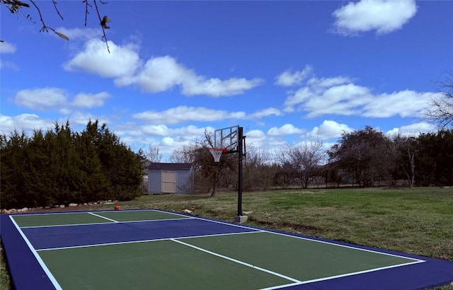 view of basketball court featuring a lawn