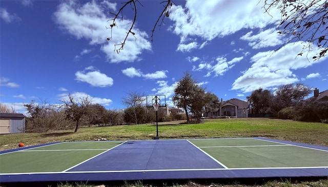 view of basketball court featuring community basketball court and a lawn