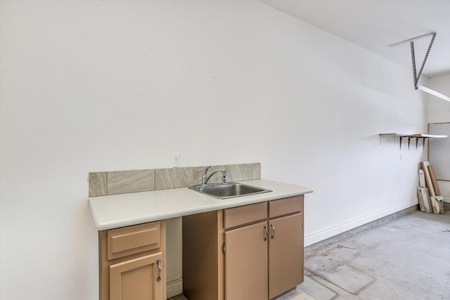 604 Caprock Canyon Trl, Georgetown, TX 78633 - laundry room with a sink and baseboards