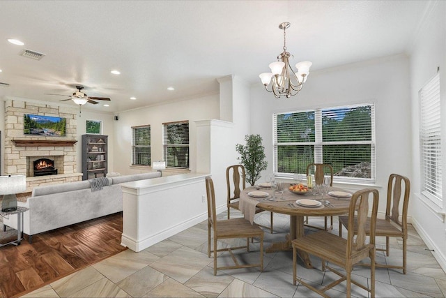 604 Caprock Canyon Trl, Georgetown, TX 78633 - dining space with recessed lighting, visible vents, crown molding, and ceiling fan with notable chandelier