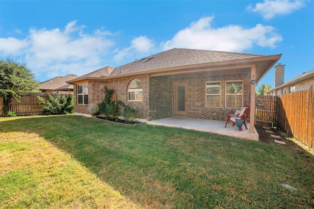 2405 Billy Pat Rd, Leander, TX 78641 - back of property featuring a patio area, a fenced backyard, and brick siding