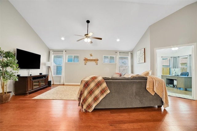 2405 Billy Pat Rd, Leander, TX 78641 - living area featuring a ceiling fan, healthy amount of natural light, wood finished floors, high vaulted ceiling, and recessed lighting