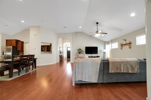 2405 Billy Pat Rd, Leander, TX 78641 - living area with arched walkways, a ceiling fan, lofted ceiling, dark wood-style flooring, and recessed lighting