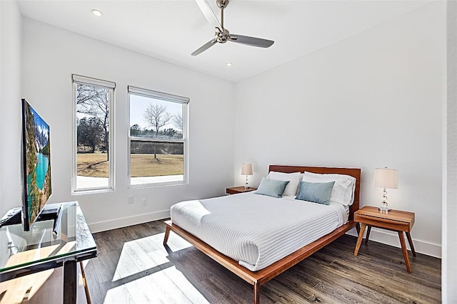 bedroom with ceiling fan, baseboards, dark wood finished floors, and recessed lighting