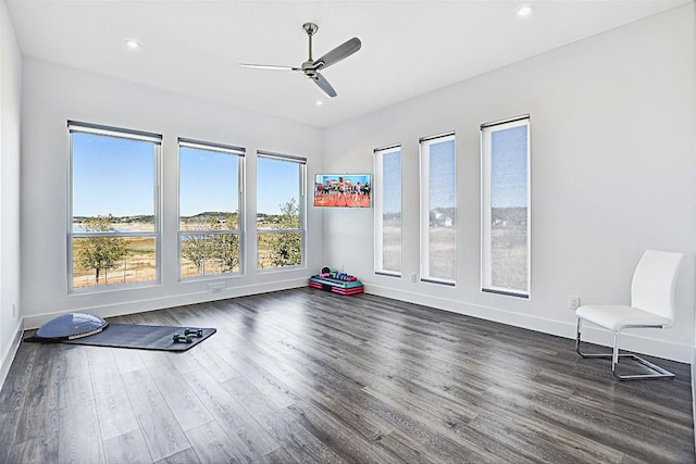 workout room featuring ceiling fan, recessed lighting, dark wood finished floors, and baseboards