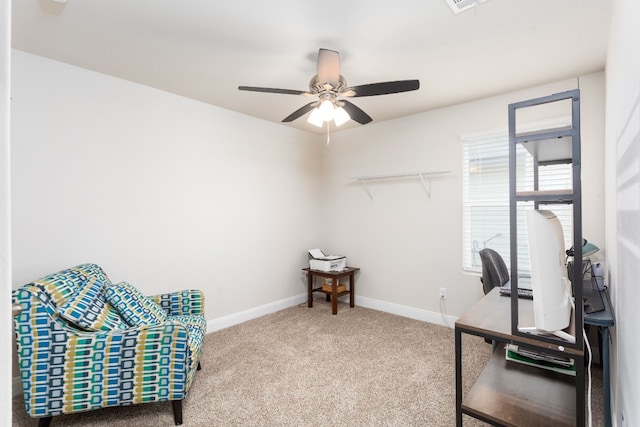 office space with carpet, baseboards, and a ceiling fan