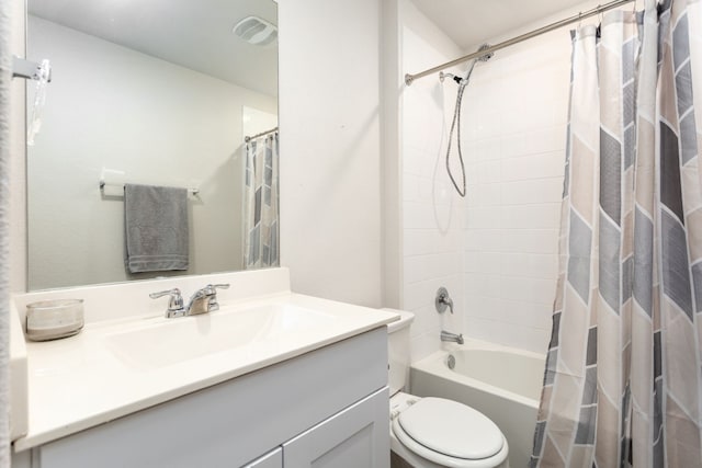 bathroom with toilet, shower / bath combo with shower curtain, vanity, and visible vents