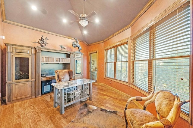 office area with lofted ceiling, light wood-type flooring, ceiling fan, and crown molding